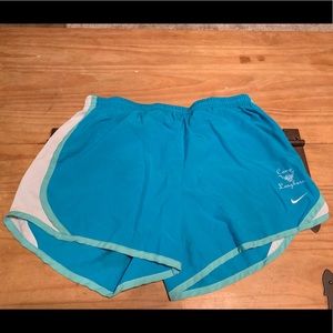 Women’s Nike running shorts with camp logo